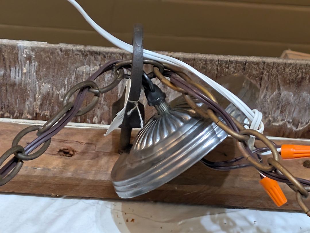 Primitive training yolk chandelier