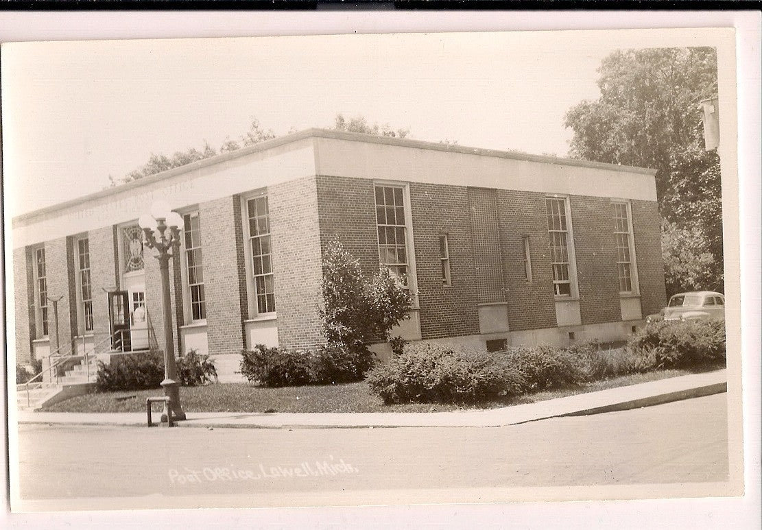 Real Photo Post Office Old lamp posts Lowell MI Michigan Mich Postcard