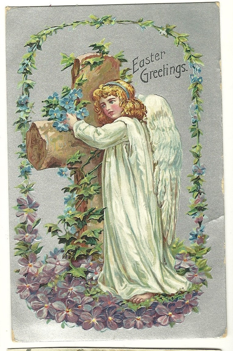 Beautiful Easter Angel hugs a large cross with flowers