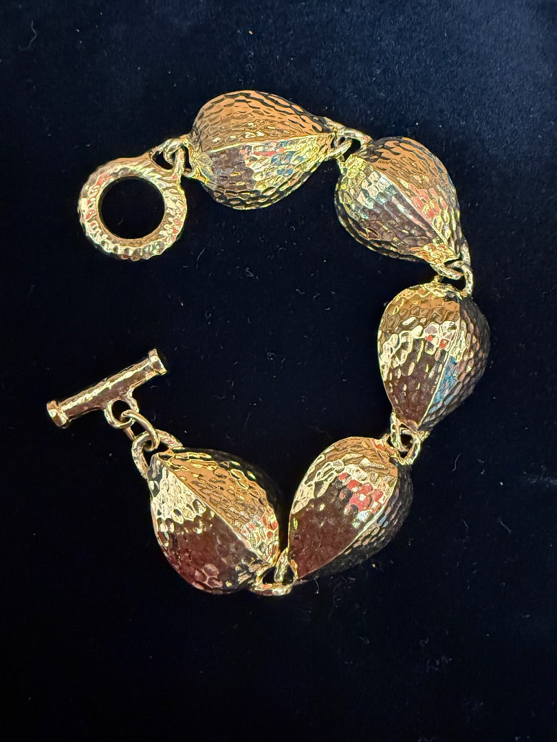AVON Gold tone hammered Bracelet
