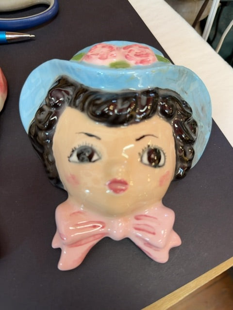 Left on blue bonnet girl