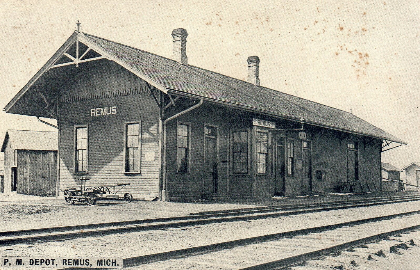 Railroad P.M. Depot in Remus Michigan Postcard