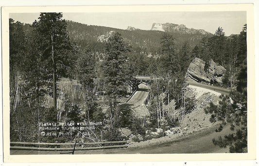 RPPC Pigtail Bridge Mount Rushmore in Background National Park SD South Dakota