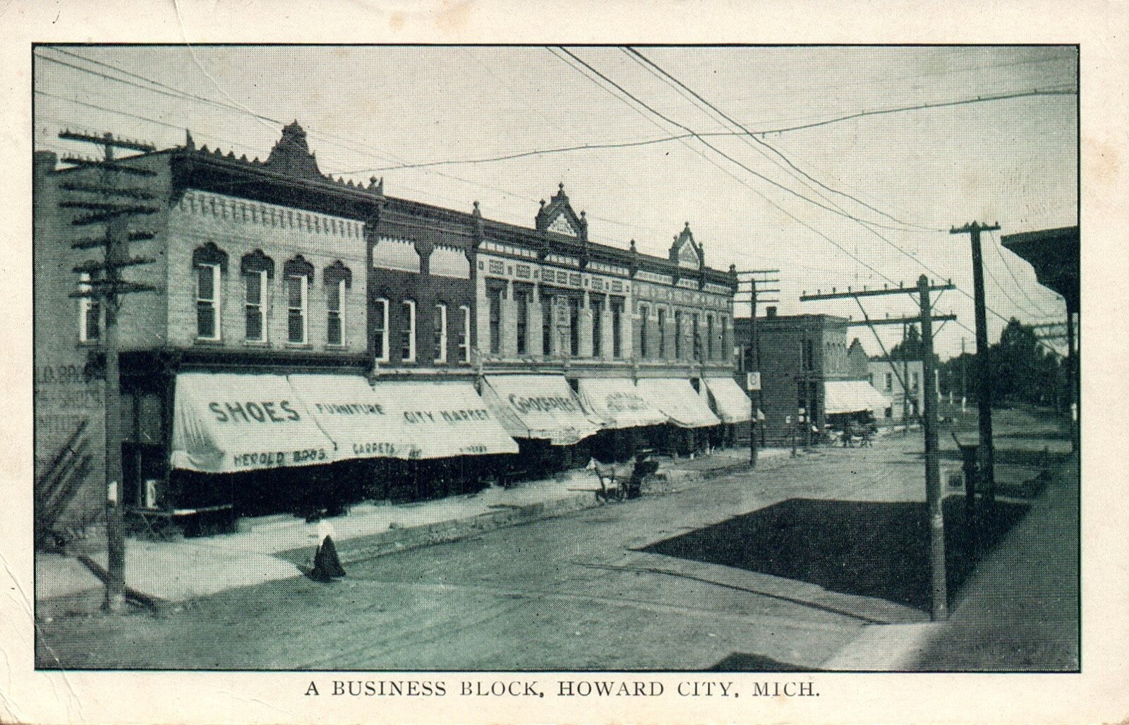 A Business Block in Howard City MI Michigan Mich Postcard