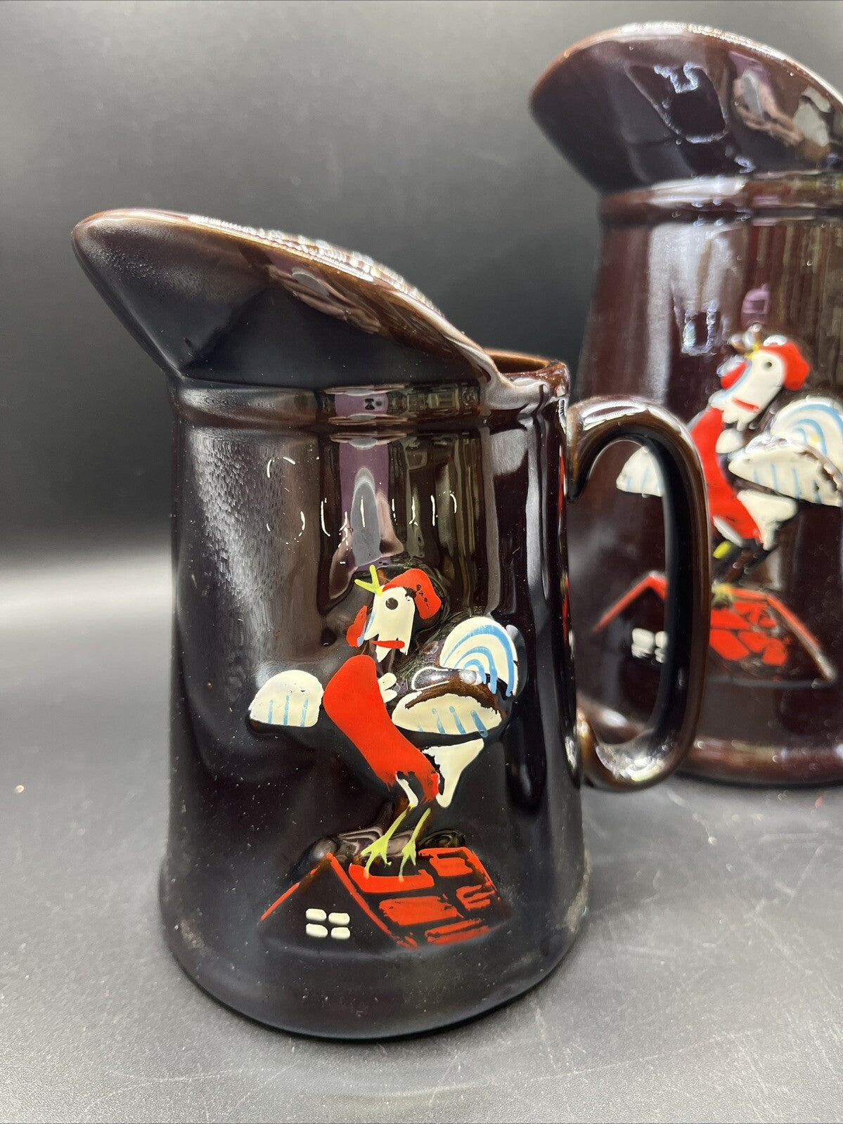 Unbranded Pair Iridescent Brown Hand Painted Embossed Rooster Pottery Pitchers