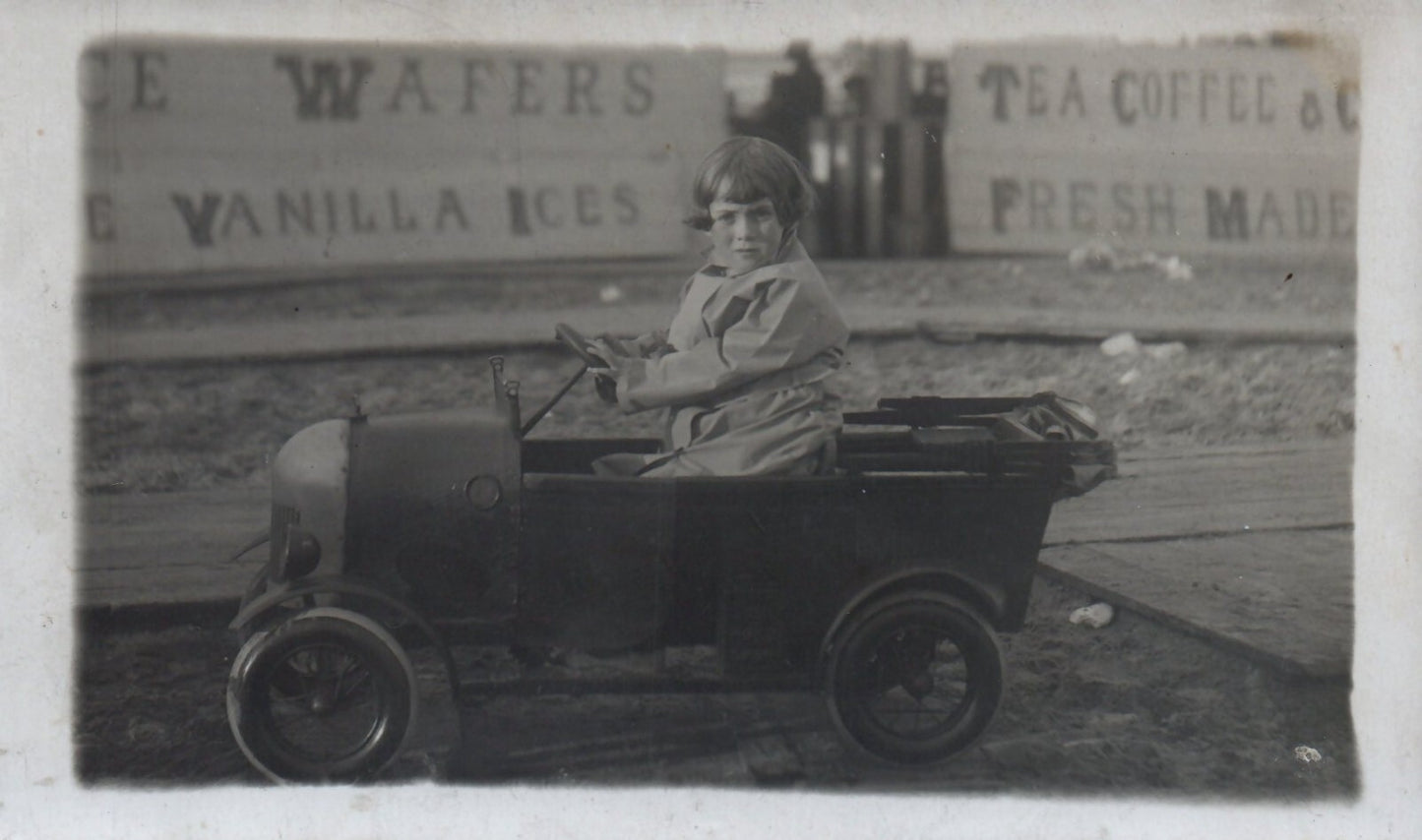 Real Photo Little British Girl Playing in Toy Pedal Car Postcard