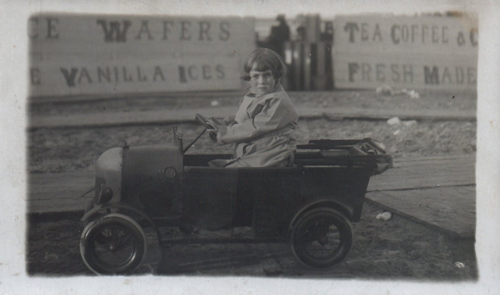 Real Photo Little British Girl Playing in Toy Pedal Car Postcard