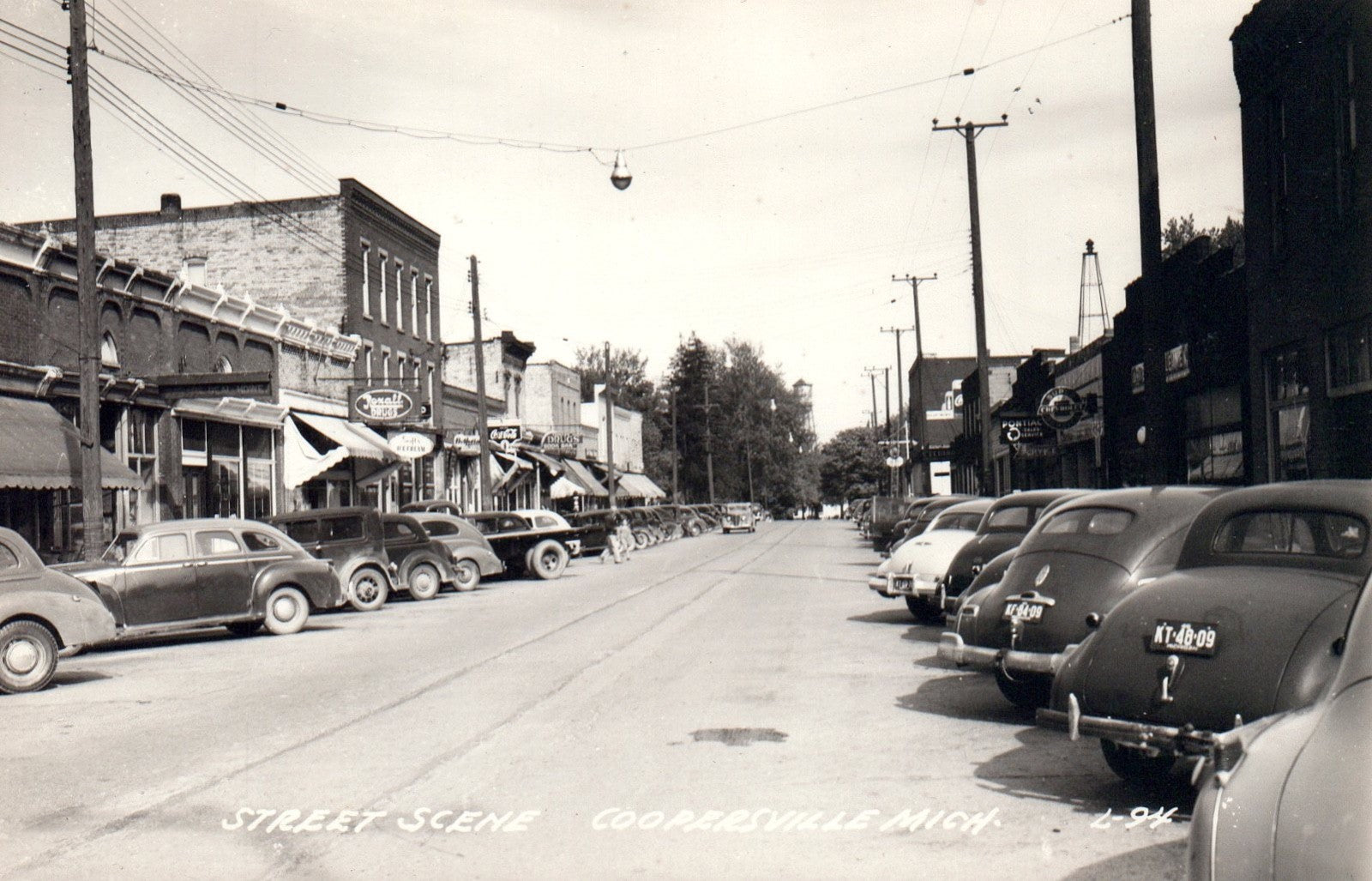 Real Photo Street Scene with Old Cars in Coopersville MI Michigan Postcard