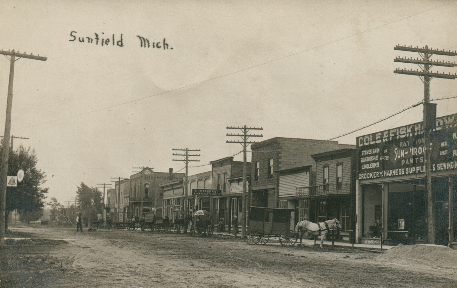 Real Photo Down Town Sunfield Michigan Mich MI Postcard horses and wagons 