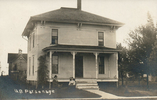 UB Parsonage Man and Woman Sitting Outside House Sunfield Michigan MI Postcard