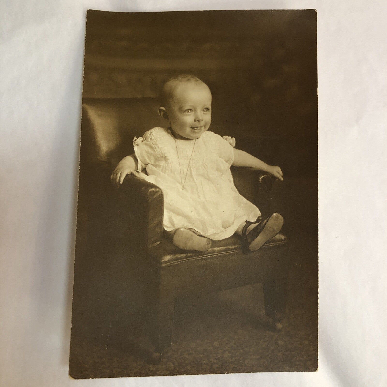 Real Photo 4" x 6" Baby with Necklace Sitting in Small Chair with Wheels