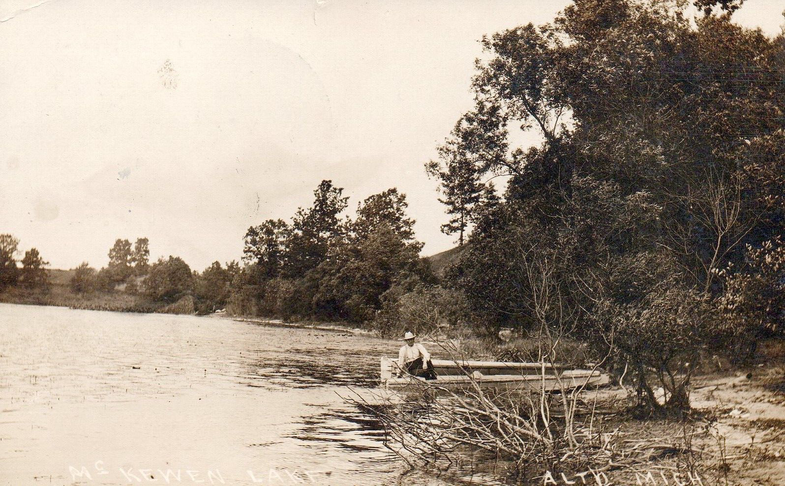 Real Photo of McKewen Lake Man on Boat in Alto Michigan Postcard