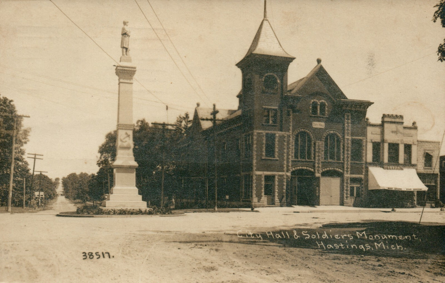 Real Photo City Hall and Soldiers Monument Hastings Michigan MI Postcard