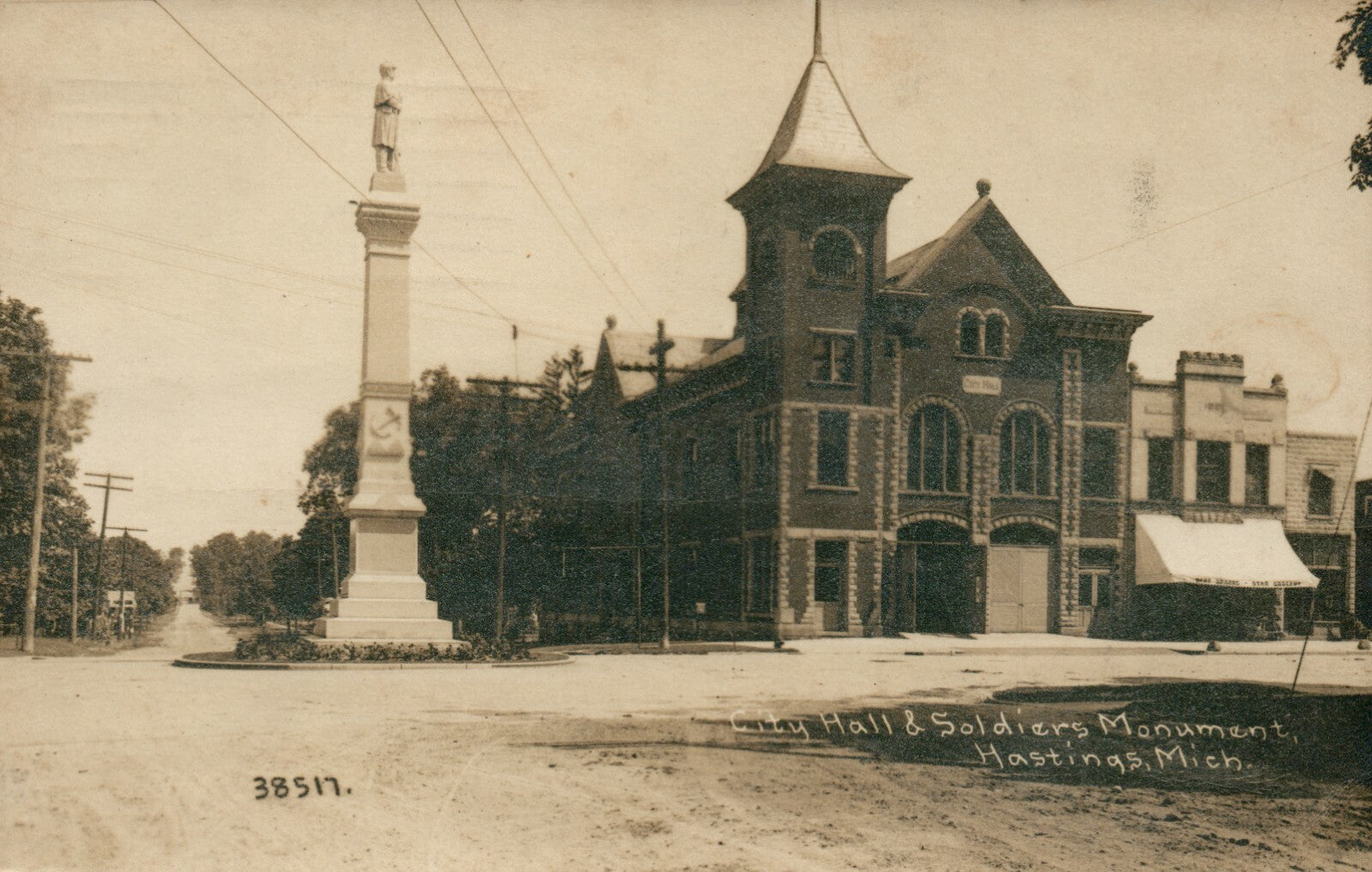Real Photo City Hall and Soldiers Monument Hastings Michigan MI Postcard