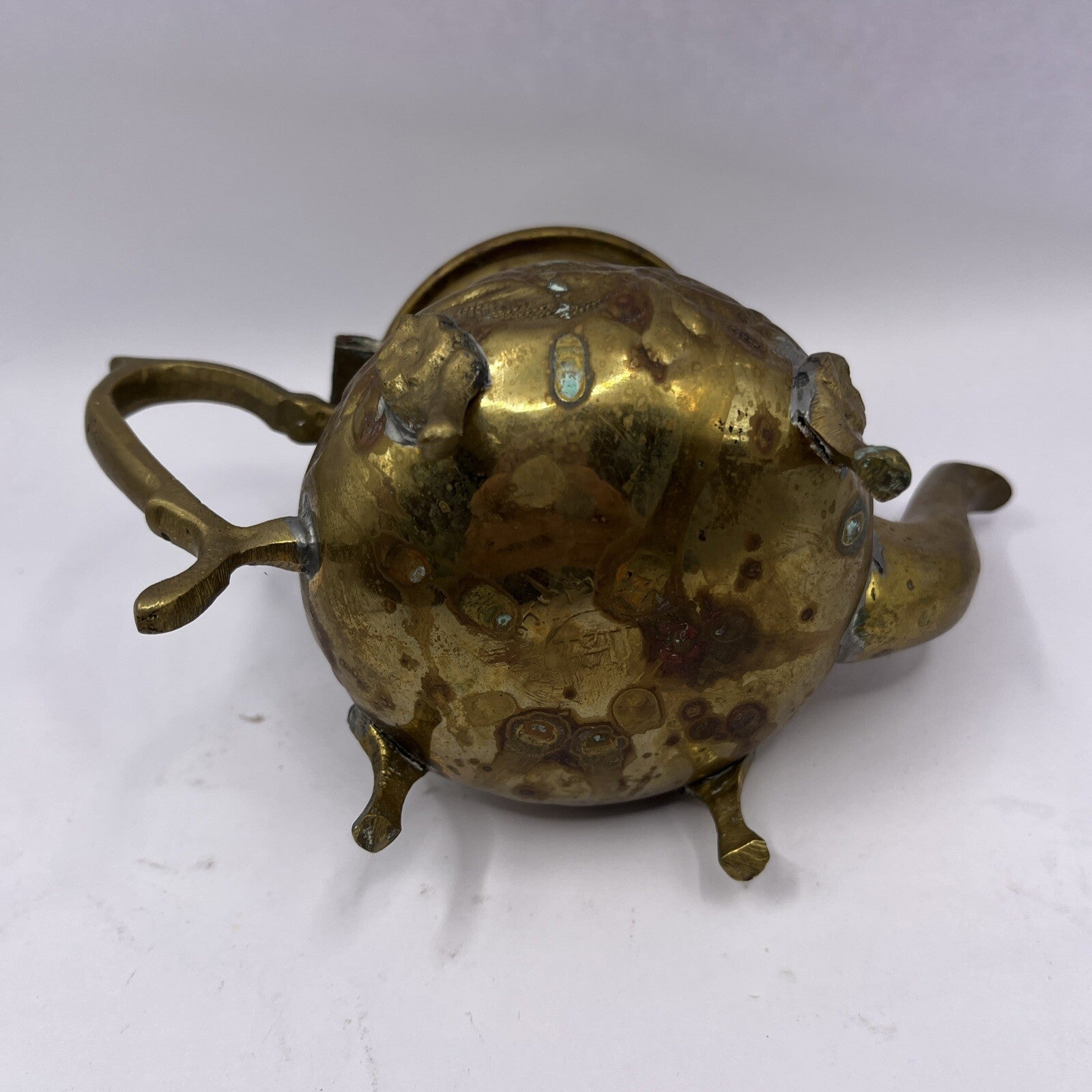 Vintage Middle East floral footed metal teapot