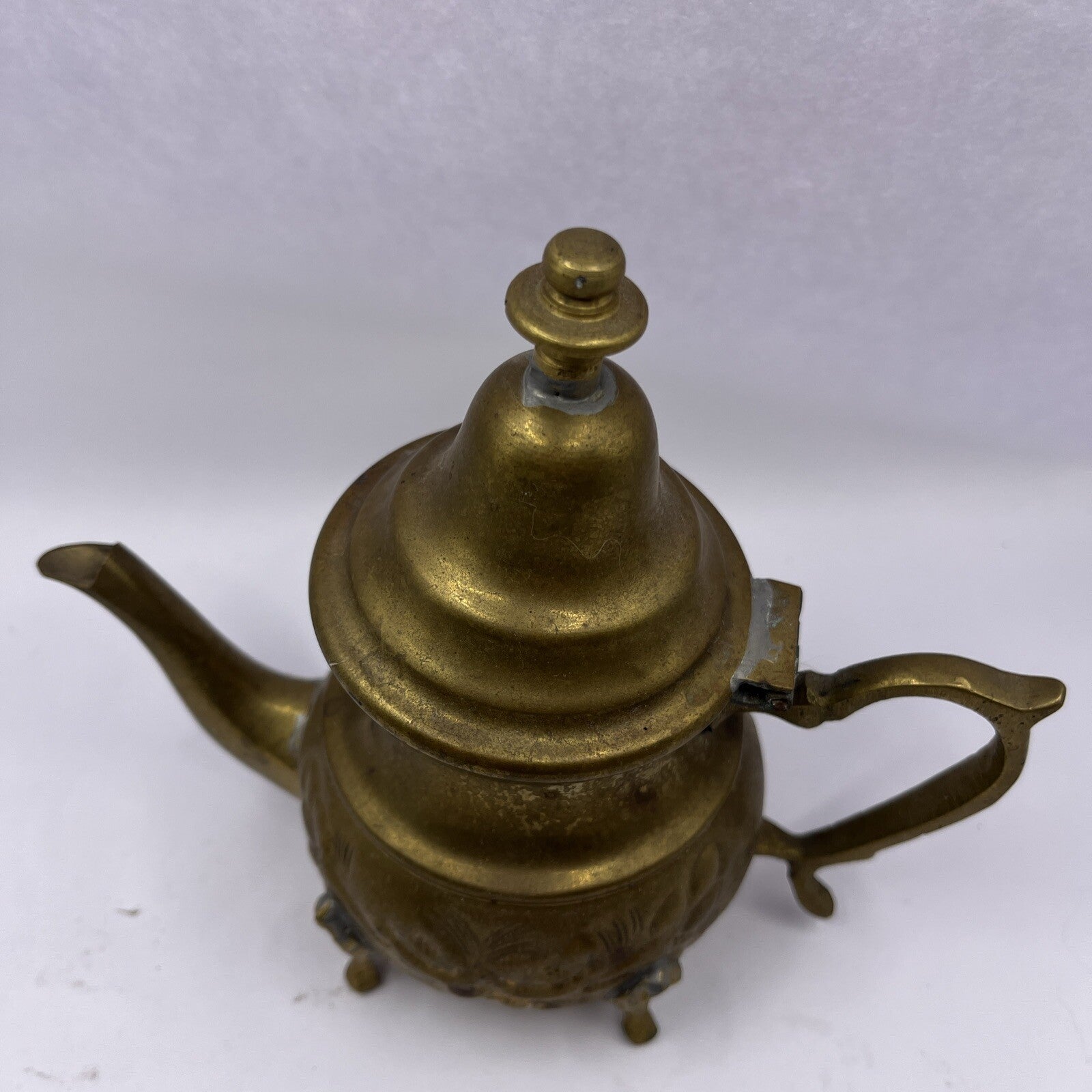 Vintage Middle East floral footed metal teapot