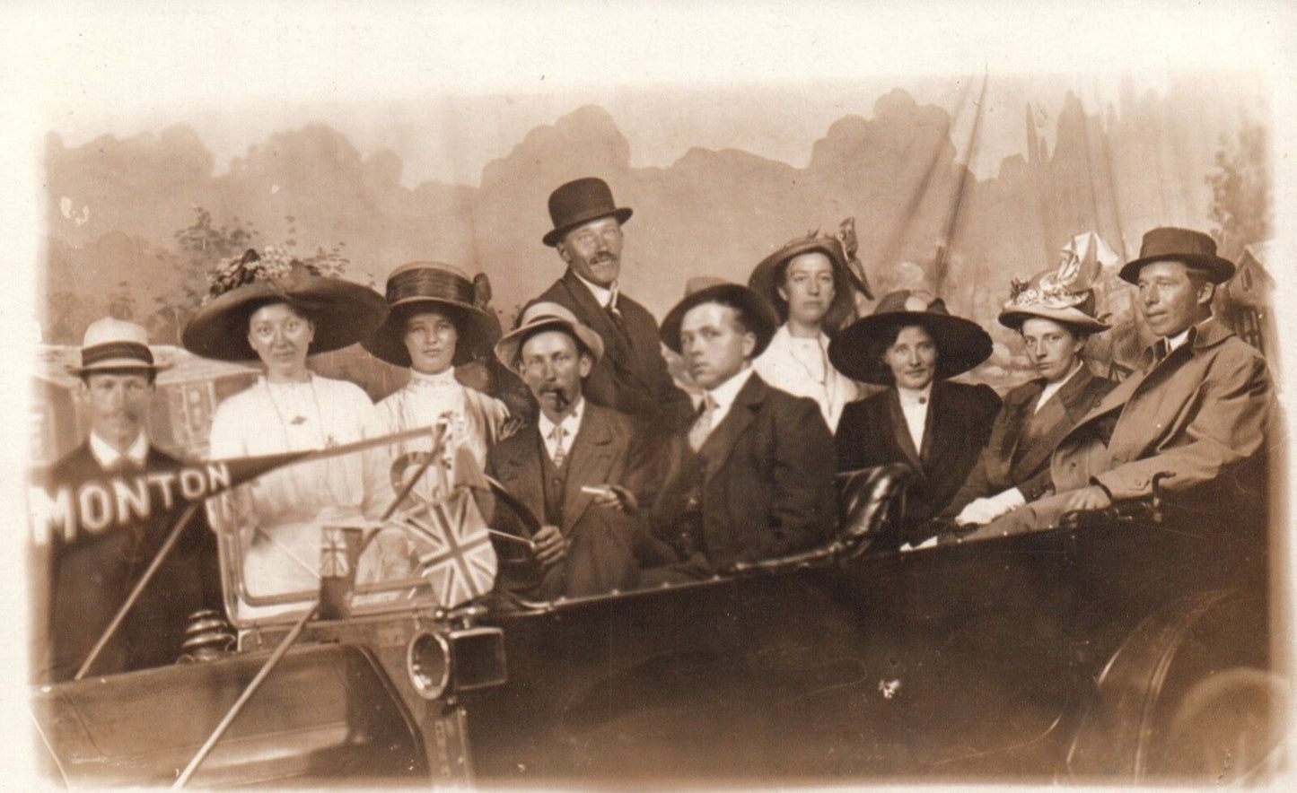 Real Photo Studio Photo of People In Car Holding Flag Monton England UK Postcard