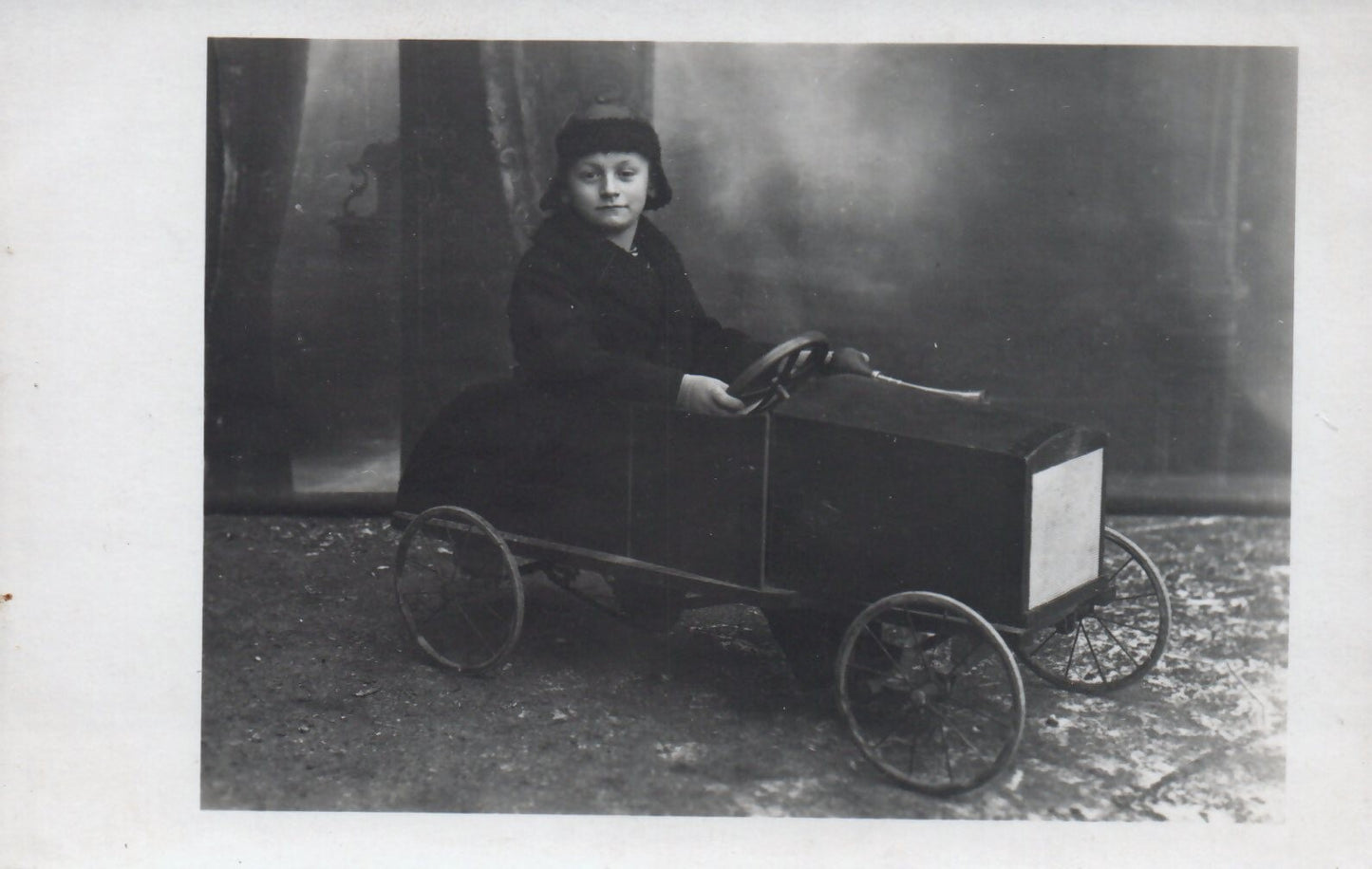 Real Photo Little Boy Playing in his Old Toy Pedal Car Postcard
