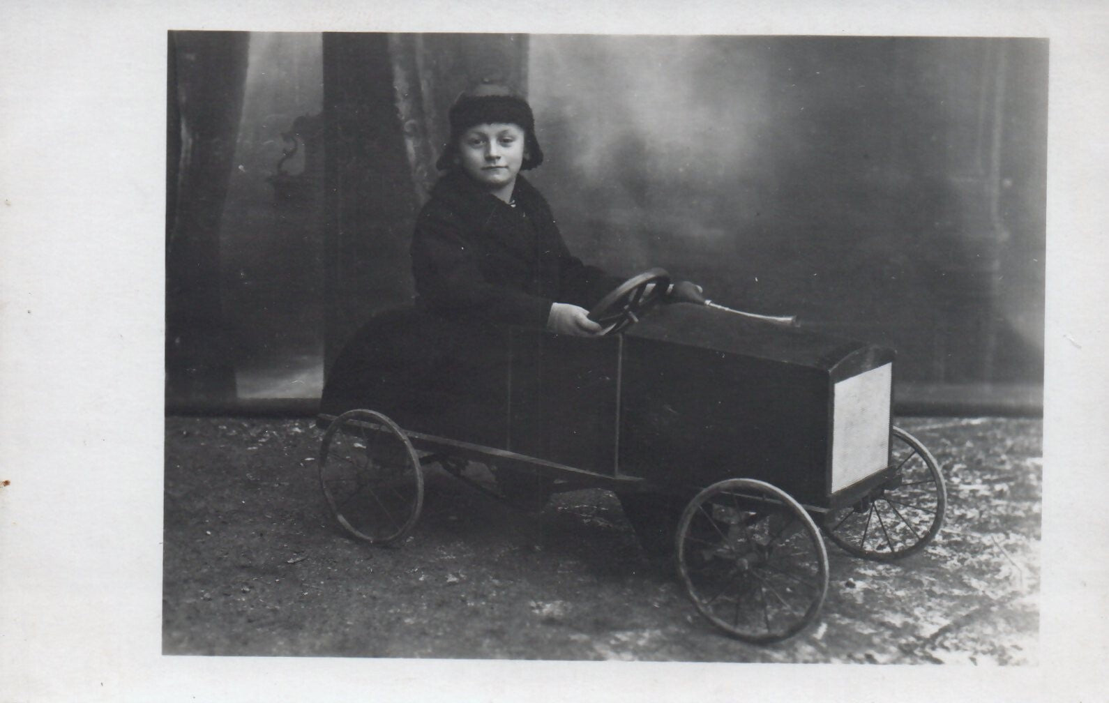 Real Photo Little Boy Playing in his Old Toy Pedal Car Postcard