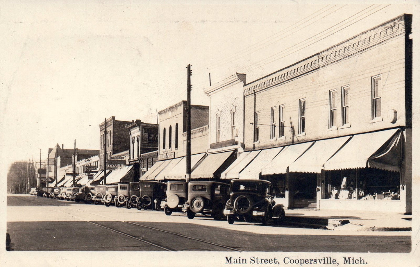 Real Photo Main Street with Old Cars Parked in Coopersville MI Michigan Postcard