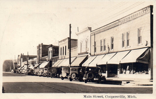 Real Photo Main Street with Old Cars Parked in Coopersville MI Michigan Postcard