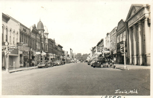 1955 Real Photo Ionia Main Street Cafe  Michigan Postcard Old cars