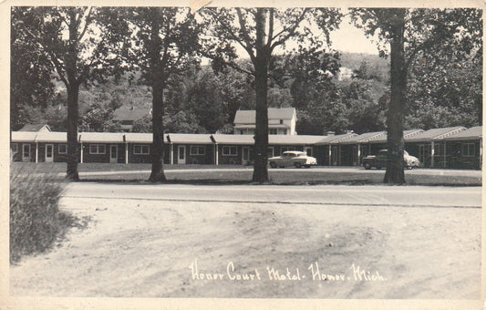 RPPC Honor Court Motel with Old Cars in Drive in Honor Michigan Postcard