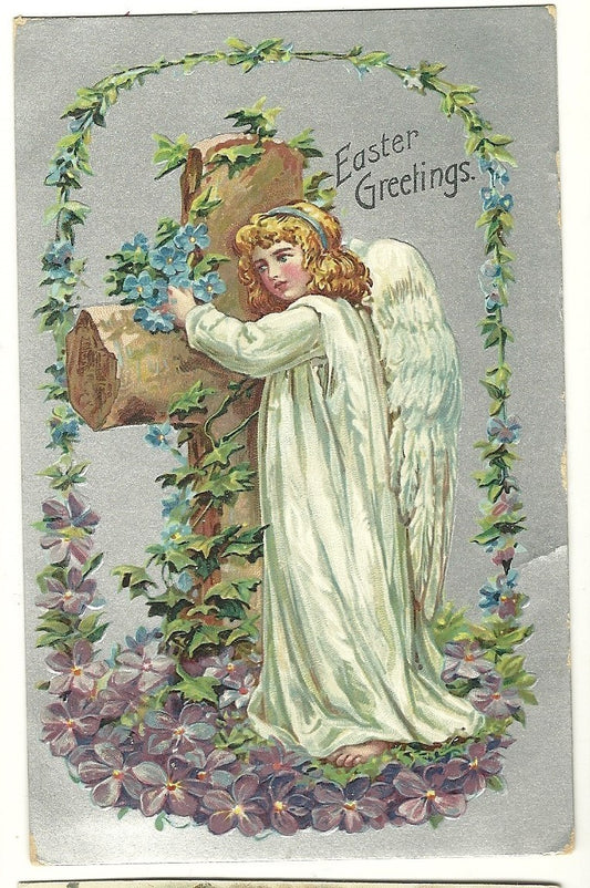 Beautiful Easter Angel hugs a large cross with flowers