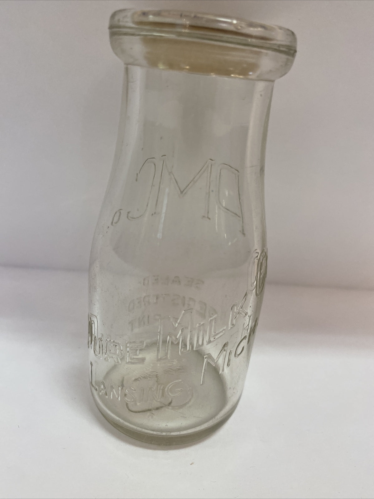 Pure Milk Dairy Co Lansing MI Michigan 1/2 pt half pint milk bottle clear PM Co