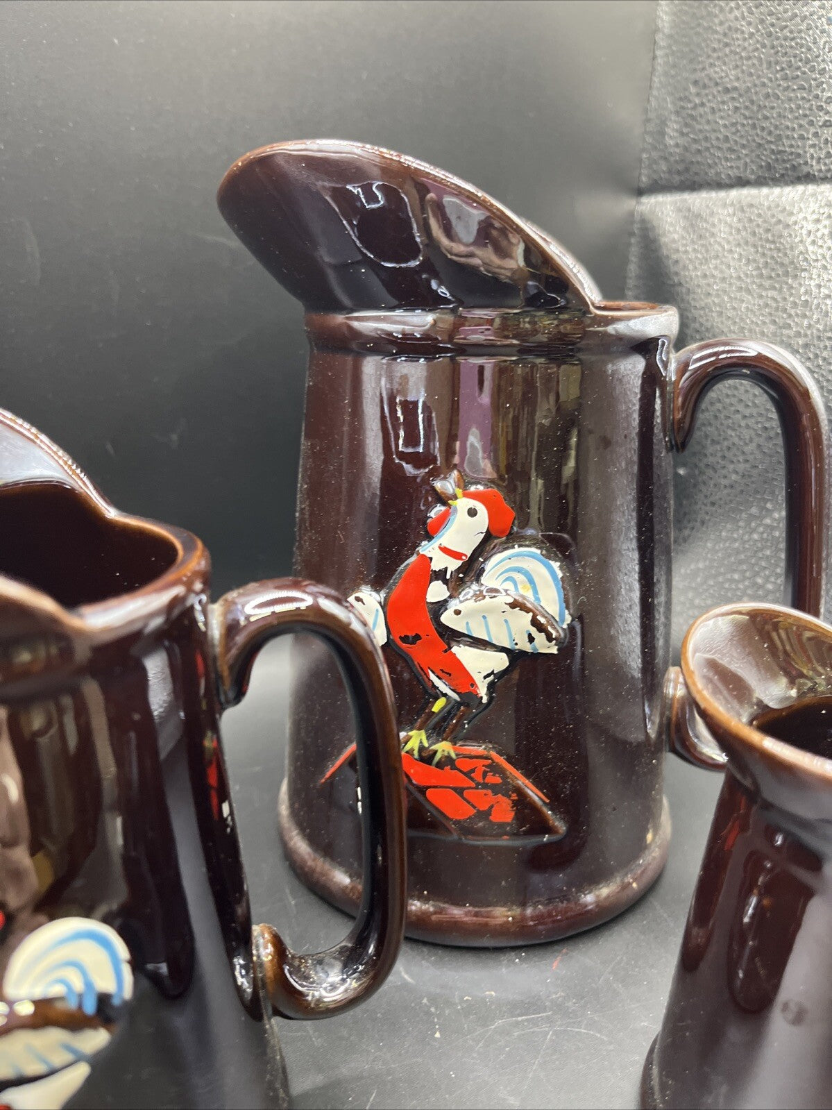 Unbranded Pair Iridescent Brown Hand Painted Embossed Rooster Pottery Pitchers