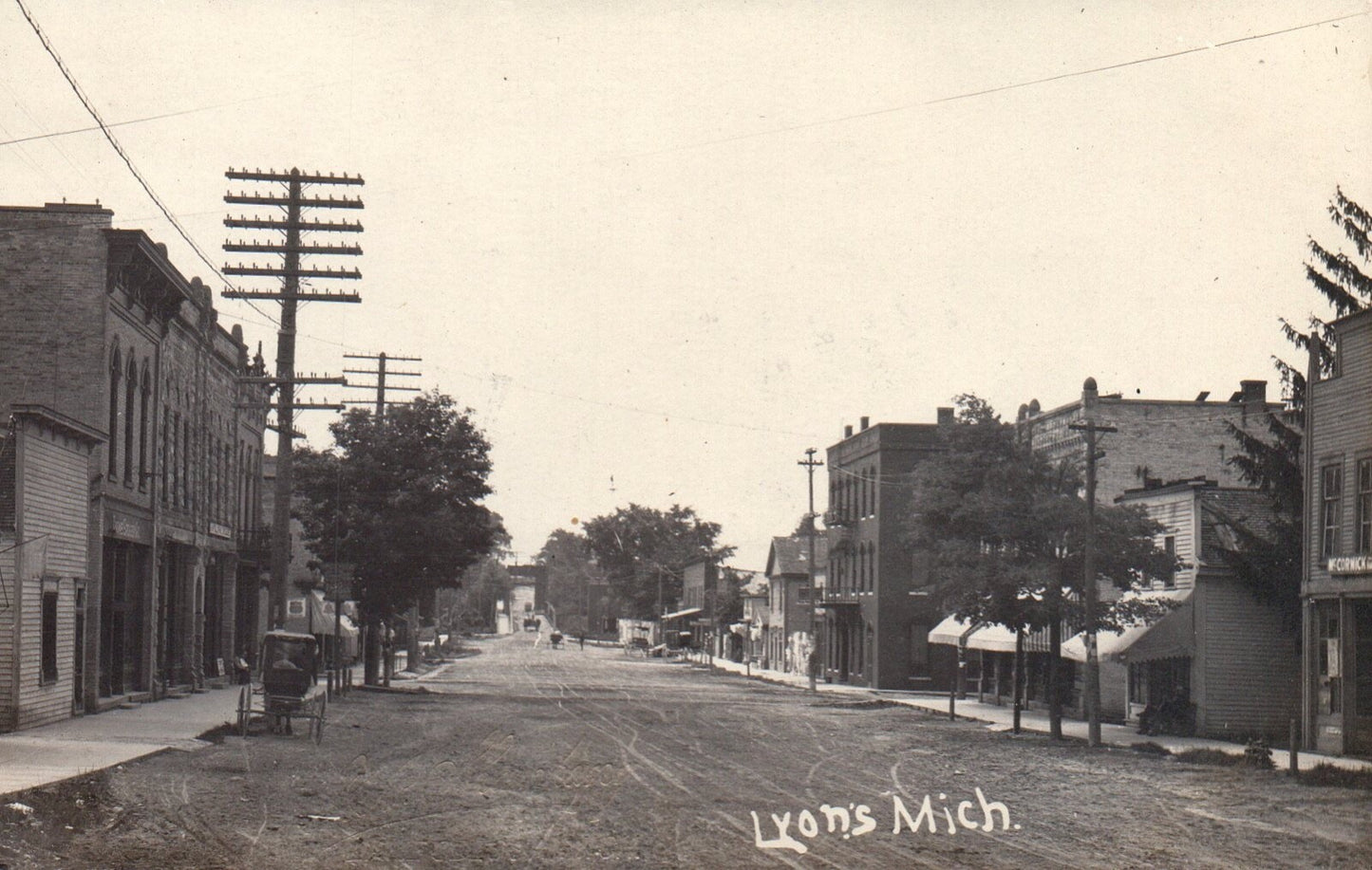 View Down Main Street with Old Car in Lyons Mich Michigan MI Vintage Postcard