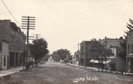 View Down Main Street with Old Car in Lyons Mich Michigan MI Vintage Postcard