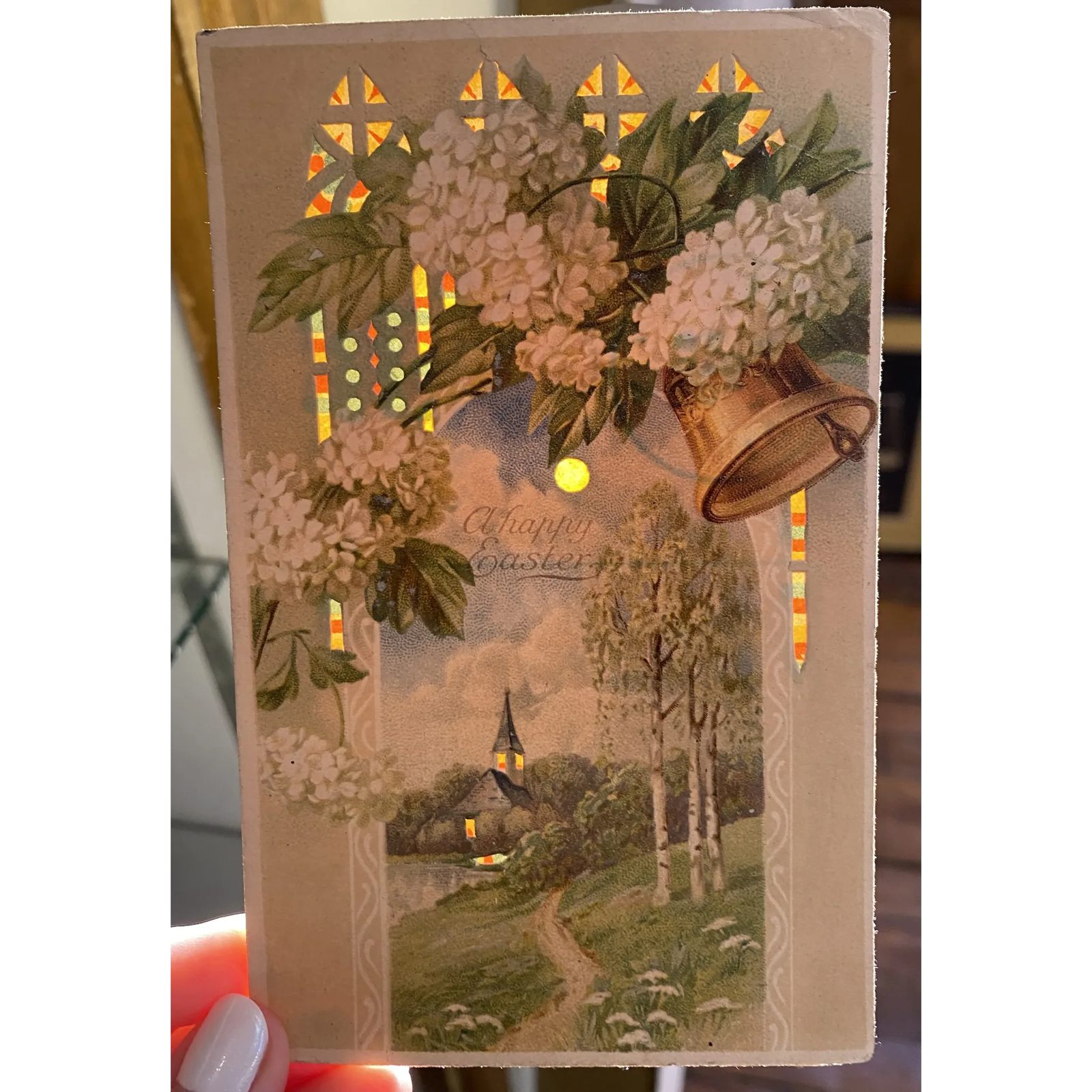 A Happy Easter Bell Ringing Flower Vintage Hold to The Light HTL Easter Postcard