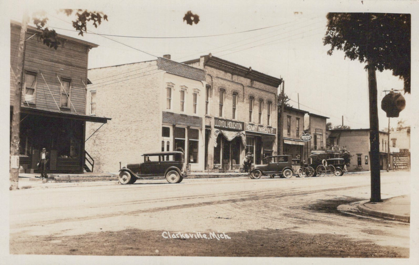 Real Photo Street View old cars Clarksville Michigan MI Mich Postcard