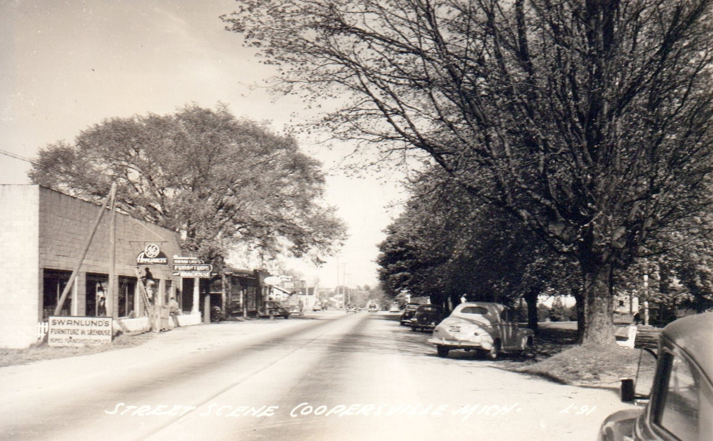 Real Photo Street Scene Stores in Coopersville MI Michigan Postcard