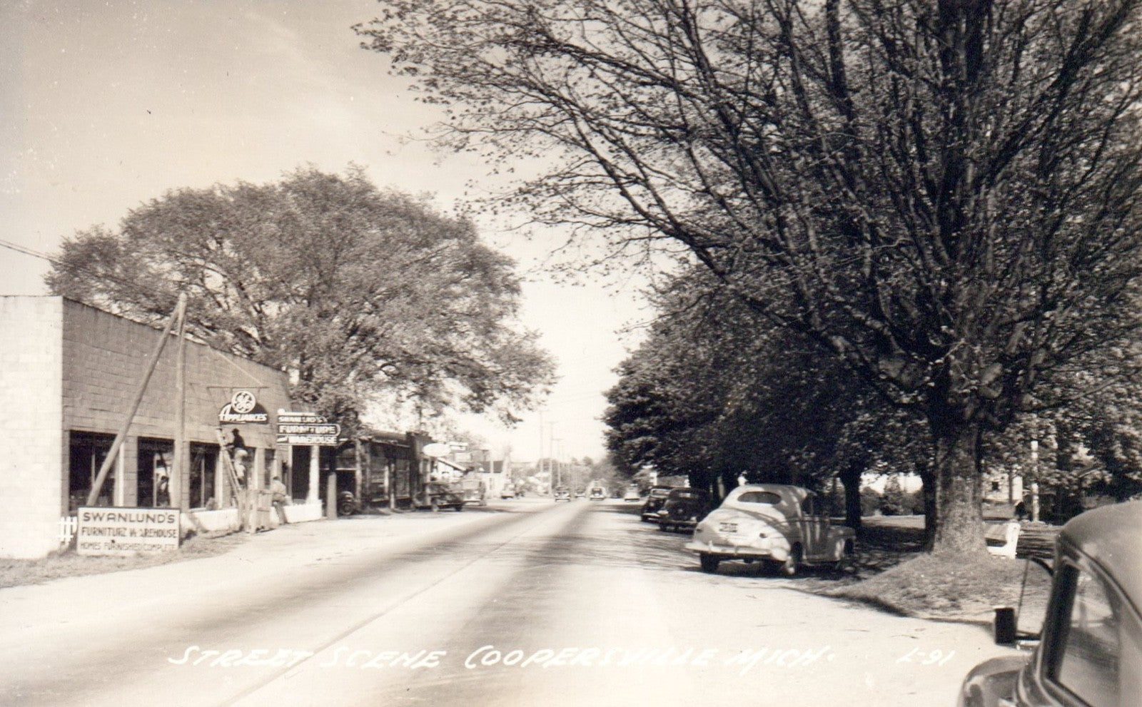 Real Photo Street Scene Stores in Coopersville MI Michigan Postcard