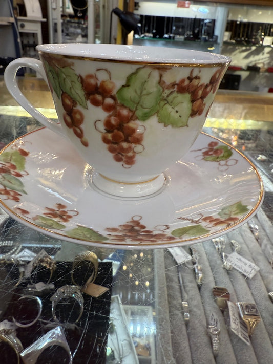 Hand painted signed China teacup and saucer