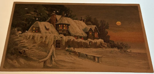 Cabin Covered in Snow Lights at Night