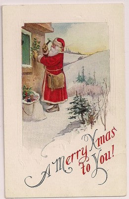 Santa Claus Hangs Holly on a house to protect the home Christmas Postcard