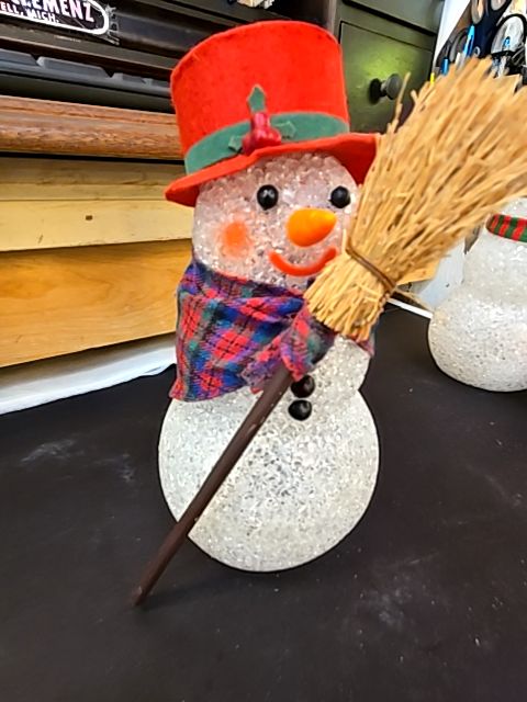 Snowman with broom