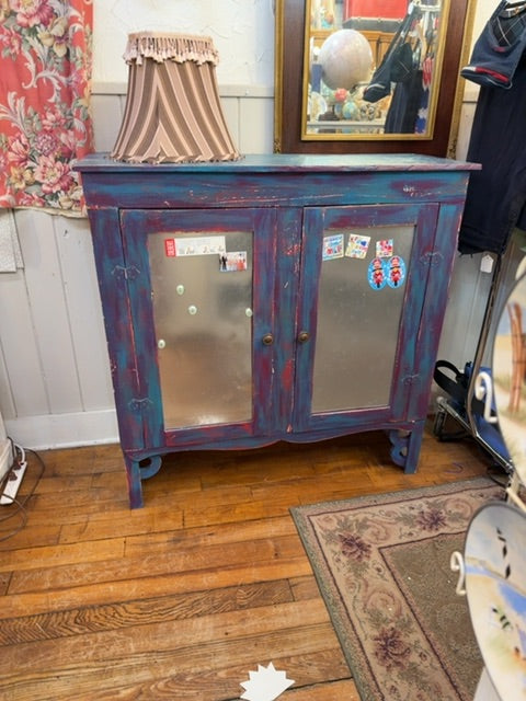 Colorful primitive cabinet