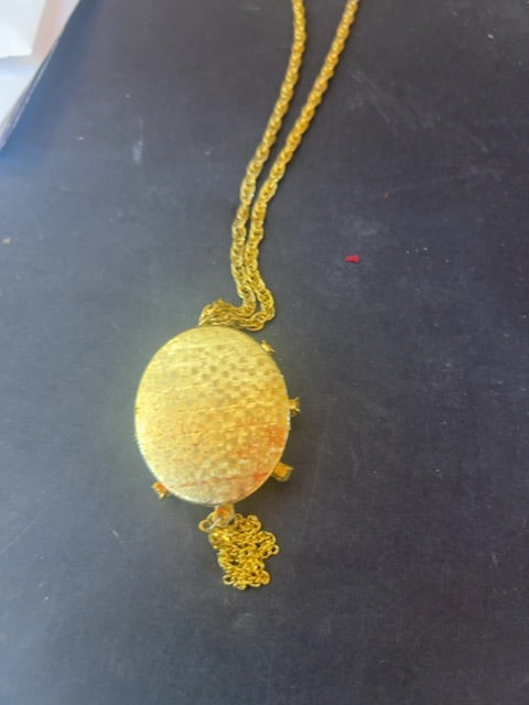 Locket with two girls on front