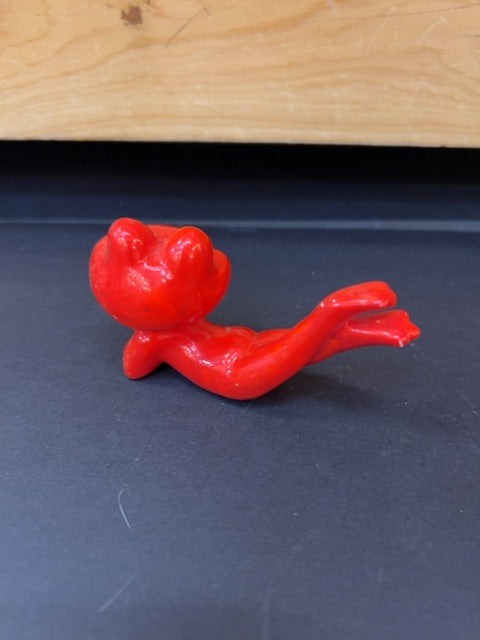 Posing red frog smiling